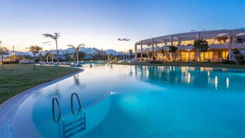 Indoor pool, pool umbrellas, sun loungers