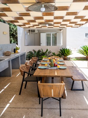 Outdoor dining - Luxurious 5 bedroom villa, private heated pool, playground, garden and BBQ! (Prines)