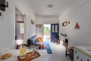 Apartment, 1 Bedroom, Sea View (3 Adults) | Living area | Flat-screen TV