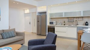 Apartemen Keluarga, 2 kamar tidur | Ruang keluarga | TV layar datar