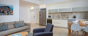 Family Apartment, 2 Bedrooms | Living room | Flat-screen TV - 2BR Private Garden Ruppin by HolyGuest (Tel Aviv)