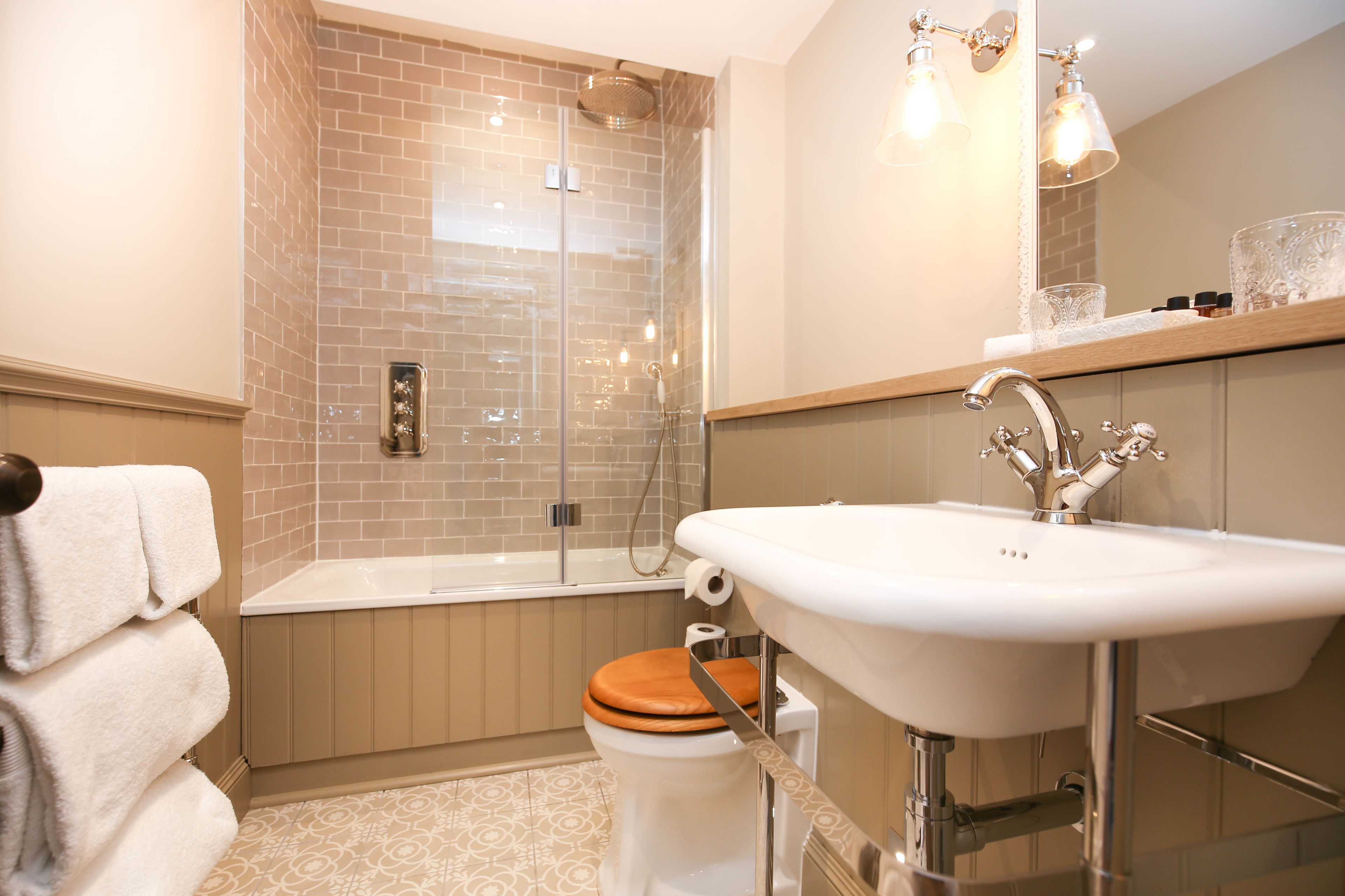 designer toiletries, hair dryer, bathrobes, slippers