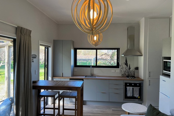 Kitchen with gas hob, electric oven, dishwasher, microwave, fridge - and a view!