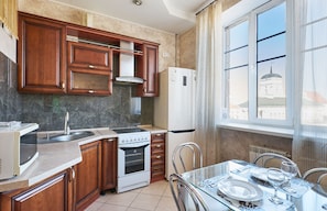 Comfort Apartment (Svobody,5) | Private kitchen | Full-sized fridge, microwave, stovetop, electric kettle