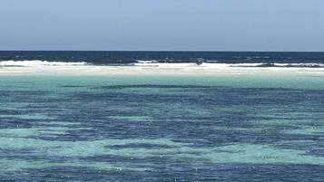 Private beach nearby, white sand, 3 beach bars