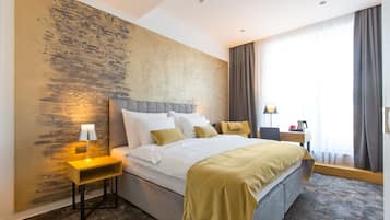 Premium bedding, down comforters, memory foam beds, in-room safe