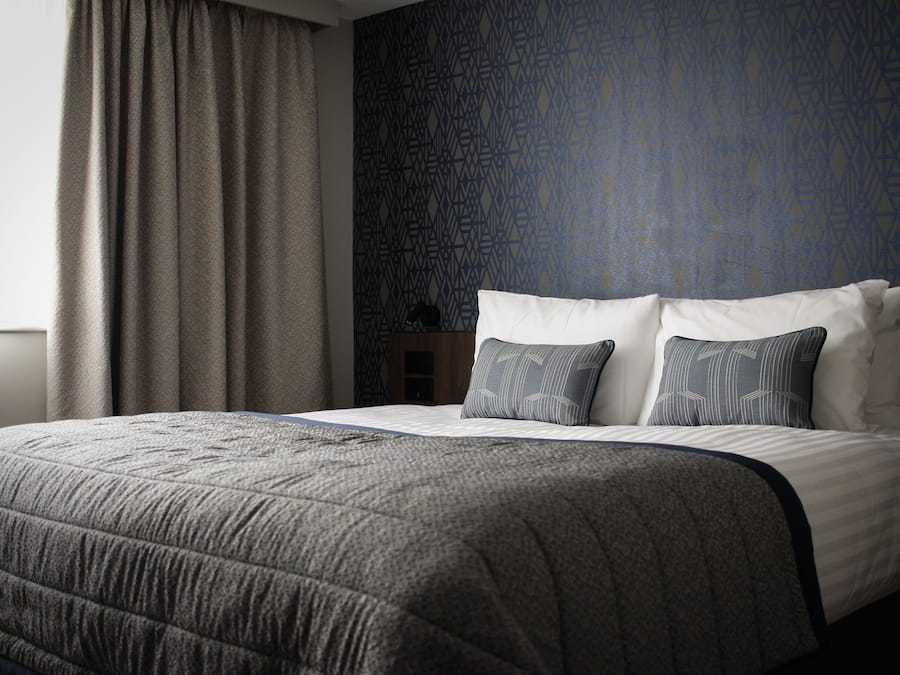 Desk, laptop workspace, blackout drapes, iron/ironing board