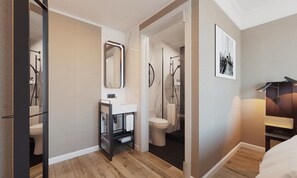 Enjoy a serene retreat with a separate bathroom, glass shower, and comfortable bed.