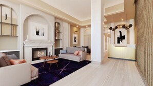 Un salon moderne avec une cheminée, des canapés et une table basse.