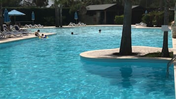 Seasonal outdoor pool, pool umbrellas, pool loungers