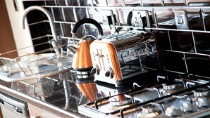 A kitchen with a stove, toaster, and kettle. - The New Mill Apartments (Newcastle-upon-Tyne)