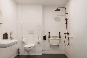 Standard Quadruple Room, Accessible | Bathroom | Shower, hair dryer, towels, soap
