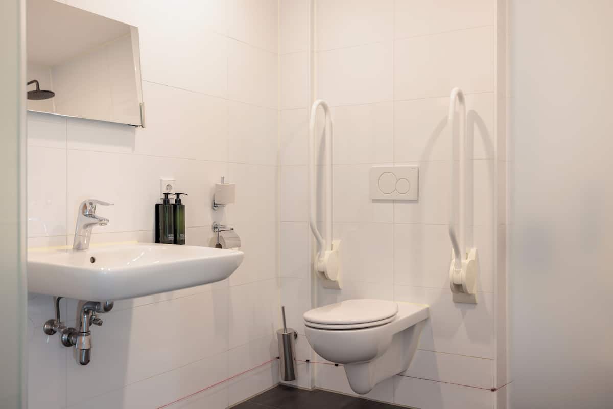 standard quadruple room, accessible | bathroom | shower, hair dryer, towels, soap