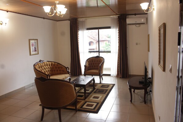 Classic Apartment, 1 Bedroom | Living area | Flat-screen TV