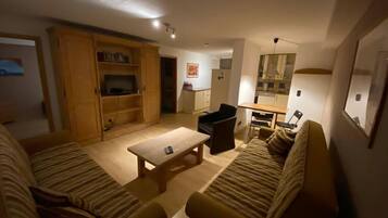 Basic Condo | Living area | Flat-screen TV