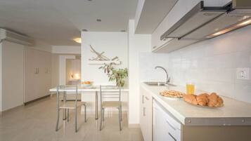 Apartment | Private kitchen | Fridge, stovetop, electric kettle, toaster