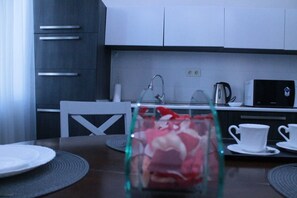 Standard Apartment (10 Giorgi Kuchishvili Street 2) | Private kitchen | Full-sized fridge, microwave, cookware/dishes/utensils - Apartment on Kuchishvili Str. (Tbilisi)