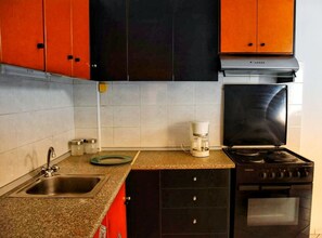 Fridge, coffee/tea maker, cookware/dishes/utensils, paper towels