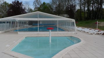 Indoor pool, seasonal outdoor pool, pool umbrellas, pool loungers