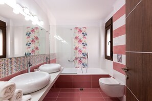 Bathtub, hair dryer, towels, soap