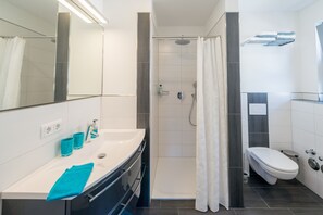 Bathtub, hair dryer, towels, soap