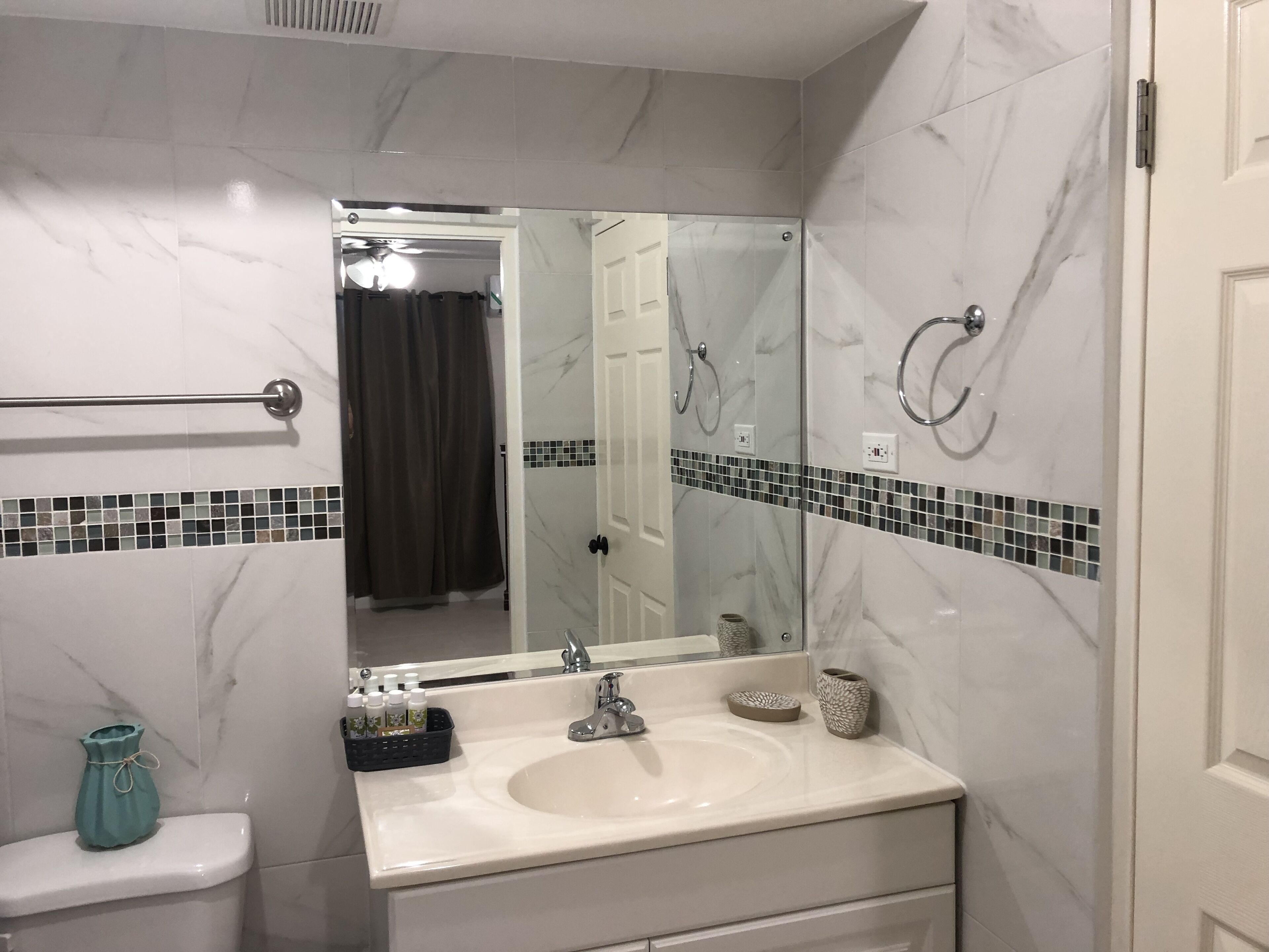 Combined shower/tub, hair dryer, towels, soap