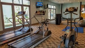 A gym with treadmills, elliptical machines, and exercise balls. - 411  Near Disney Charming Spot! (Kissimmee)