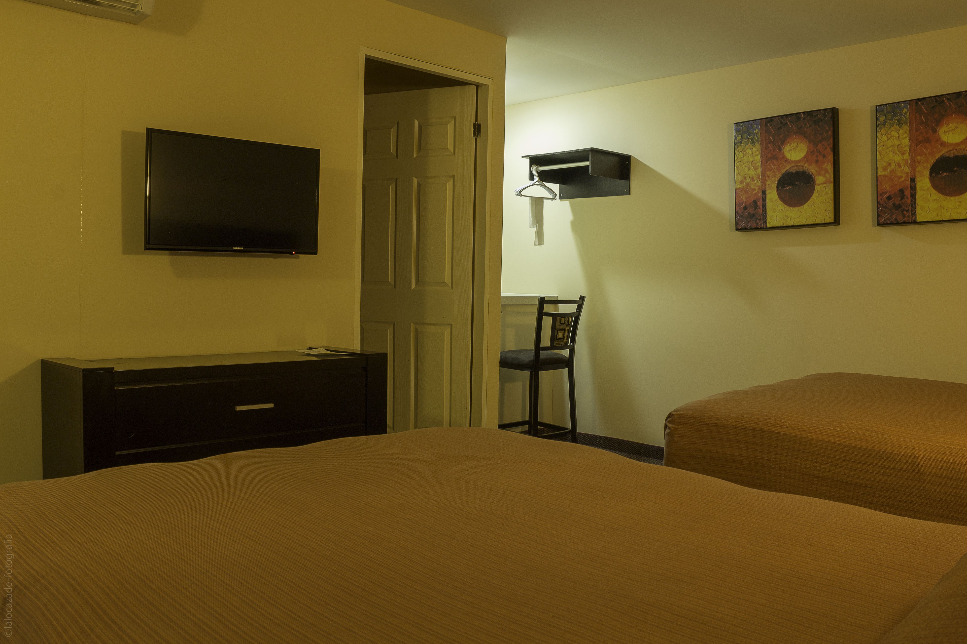 desk, laptop workspace, blackout curtains, iron/ironing board