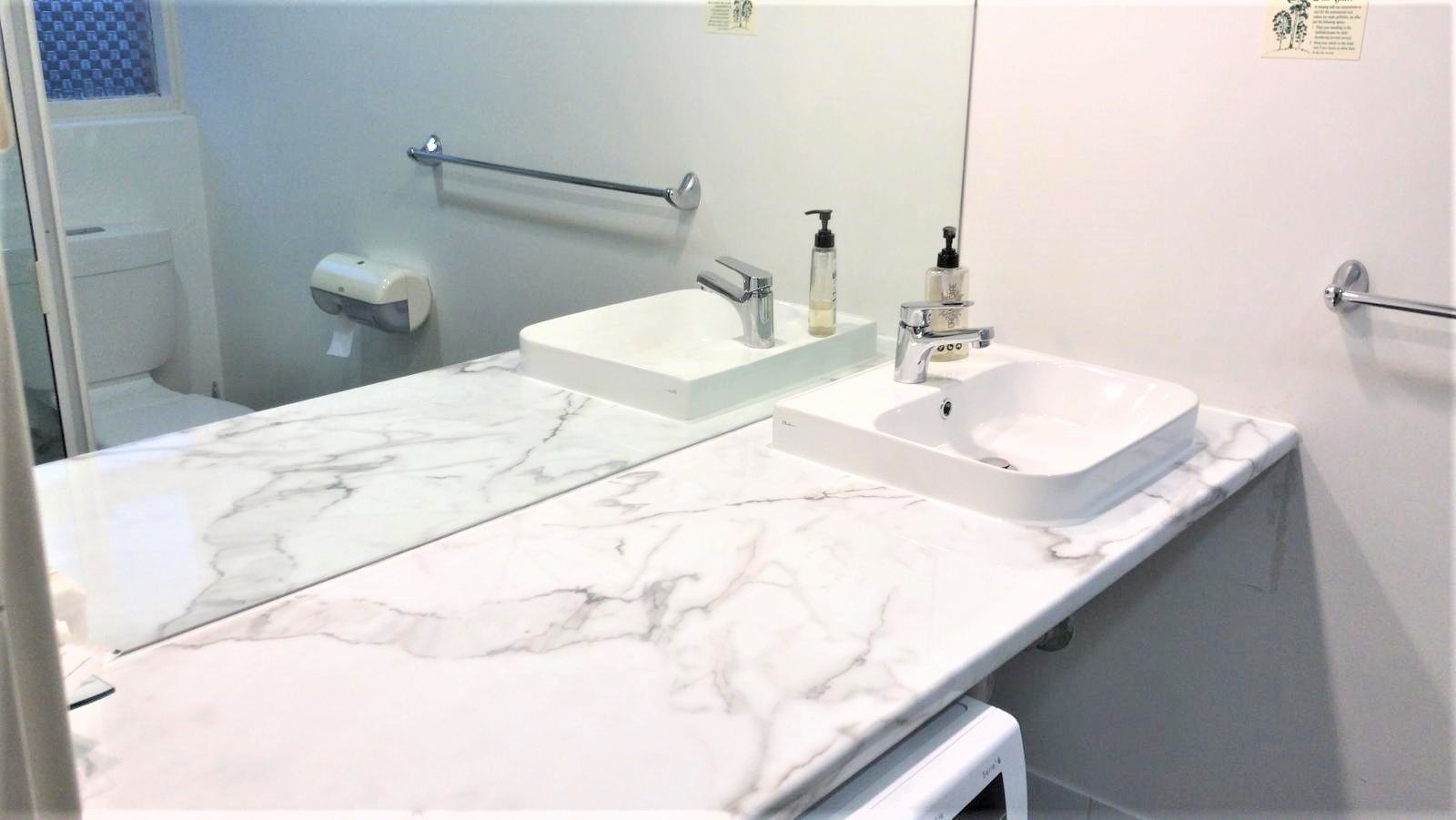 Studio Suite | Bathroom | Shower, towels, toilet paper