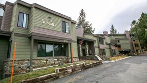 A building with a sign reading "The Summit" and the number 3253.