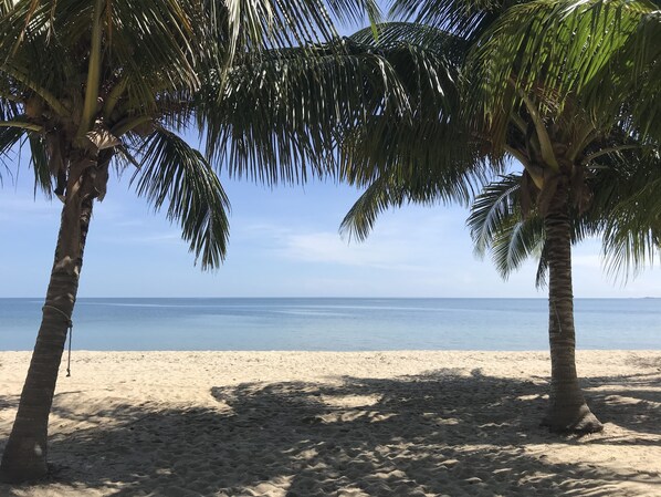 On the beach, sun-loungers, beach towels