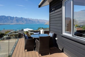 Enjoy breathtaking views of the surrounding mountains and water from this balcony.