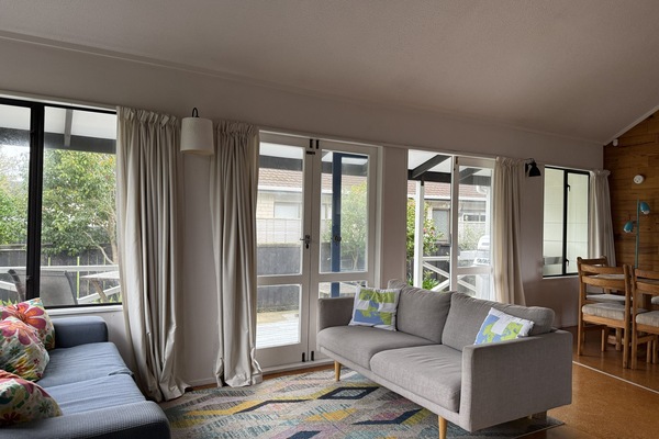 Another seating space and 2 sets of french doors to the deck