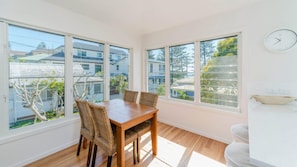 Enjoy meals in this dining area with a view of the surrounding neighborhood.