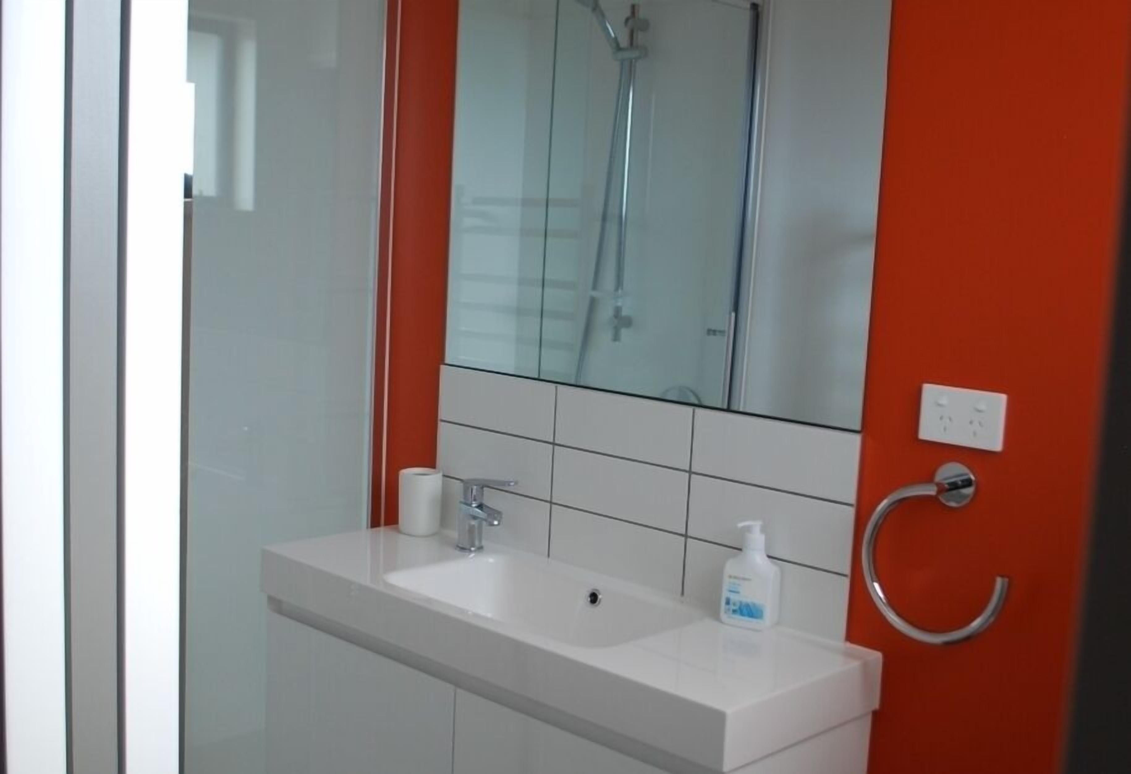 Shower, hair dryer, soap, toilet paper