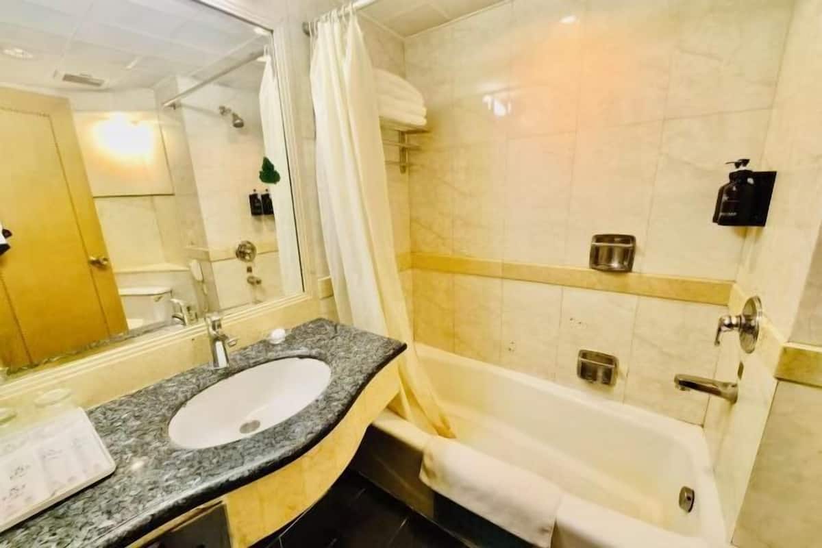 Bathroom | Shower, free toiletries, hair dryer, slippers
