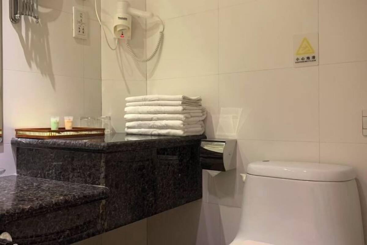 Bathroom | Shower, free toiletries, hair dryer, slippers