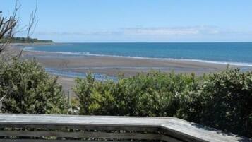 On the beach, sun-loungers