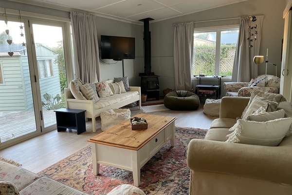 Cozy up to the fireplace in the open plan living space.