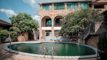 Outdoor pool, open 9:00 AM to 6:00 PM, pool umbrellas, pool loungers