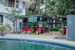 Outdoor pool, open 9:00 AM to 6:00 PM, pool loungers