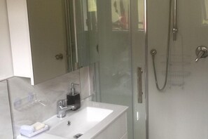 Bathtub, hair dryer, towels, soap