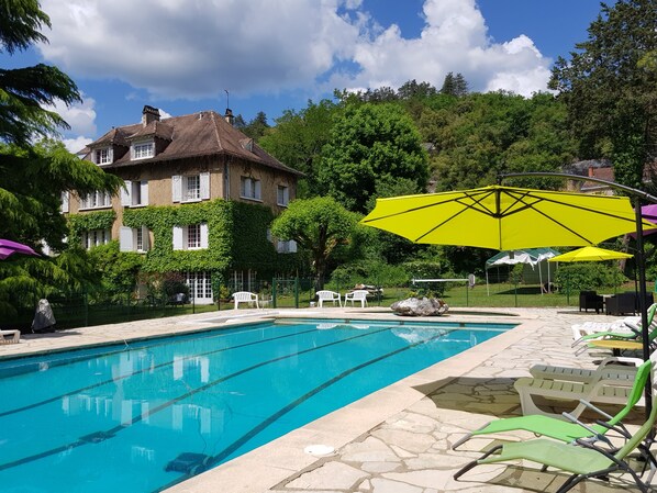 Seasonal outdoor pool, pool umbrellas, pool loungers