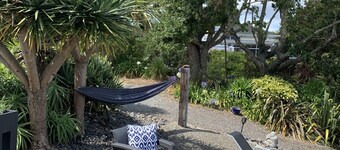 Sea, bush and gardens surround Mason Lane Apartment