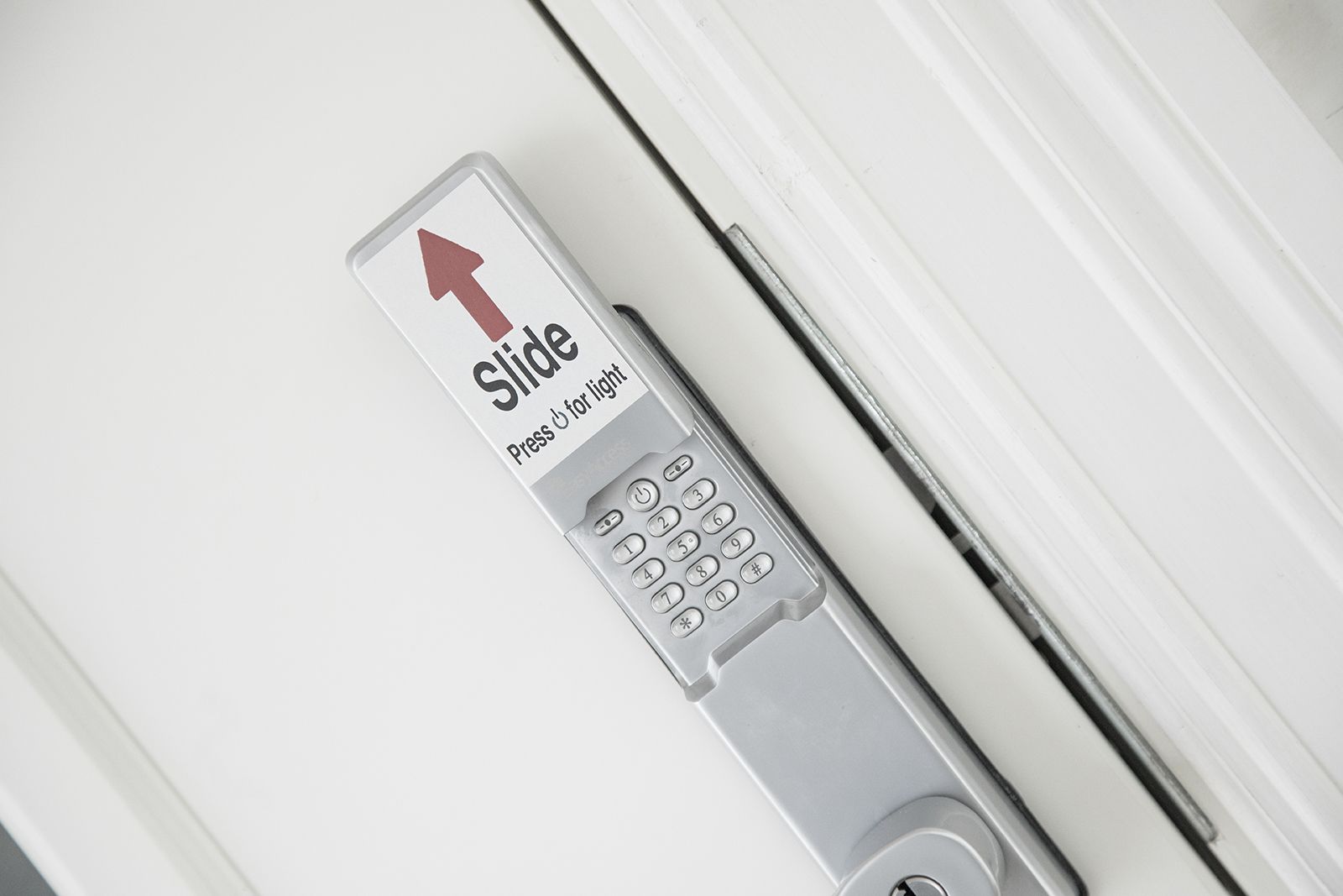 A keycard with a directional arrow and a keypad, likely for a hotel room access system.