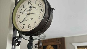 A wall-mounted Grand Central Terminal clock with a New York label. - Skyline Apartments Raglan (Upper Apartment) (Raglan)