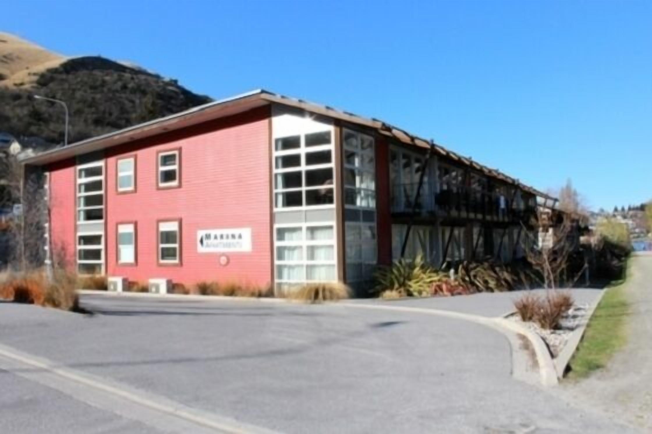 A red building with a sign that reads "AMARINA".
