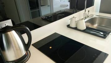 Microwave, electric kettle, cookware/dishes/utensils, spices