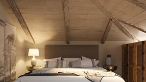 A bedroom with a wooden ceiling, a bed with multiple pillows, a bedside lamp, and a nightstand. - Anemelia Retreat (Zakynthos)
