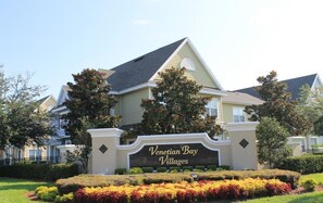 A residential building with a sign reading "Venetian Bay Villages."